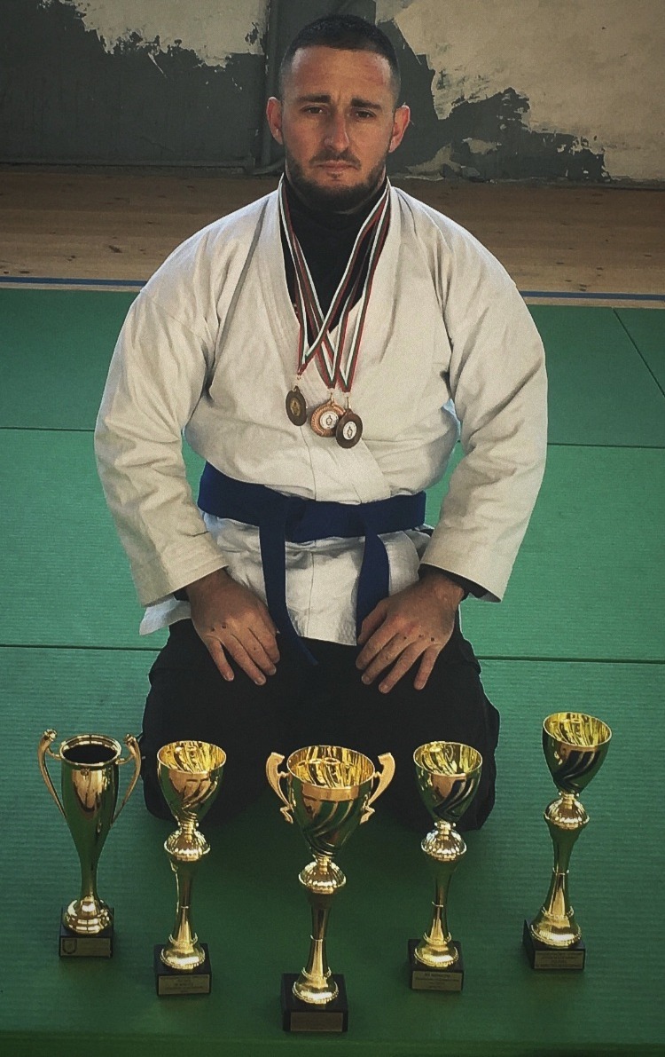 Aleksandar Atanasov with martial-arts medals and trophies Aleksandar Atanasov with martial-arts medals and trophies